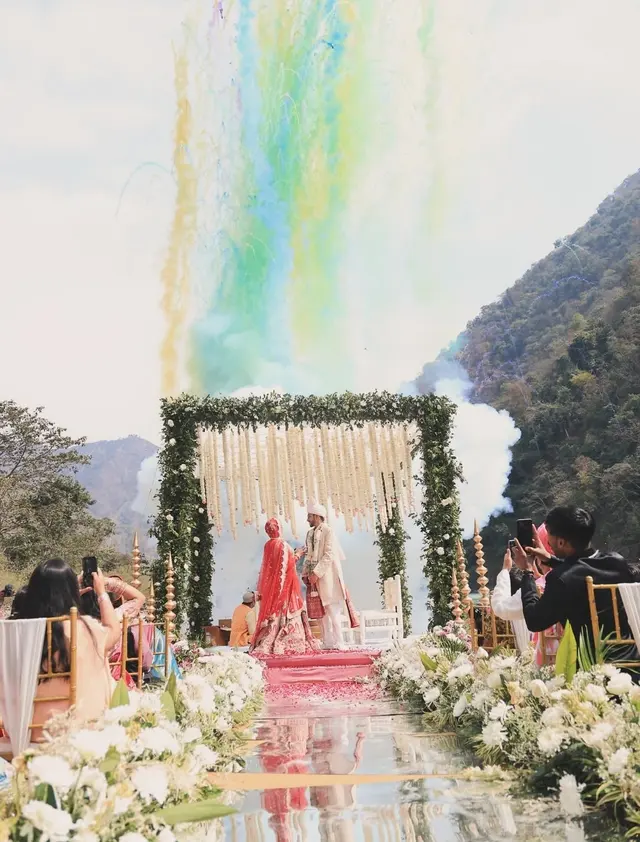 Destination wedding couple by the river in the hills