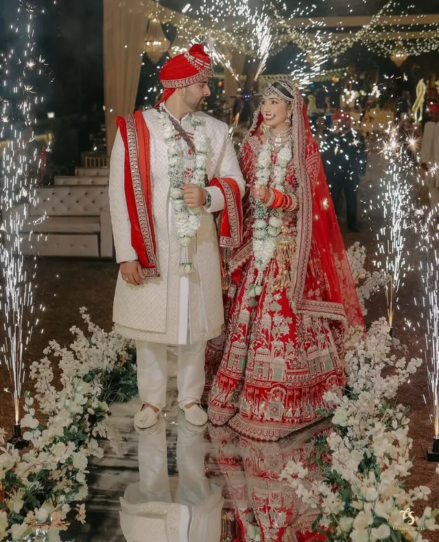 Bride and groom in a floral wedding setup