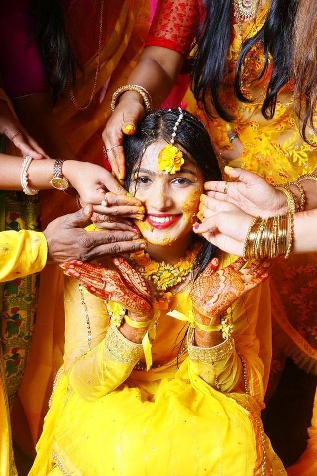 Marigold haldi backdrop with a decorated seat